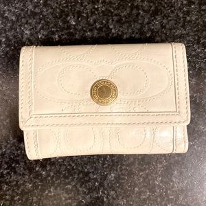 COACH mini tri-fold leather wallet.